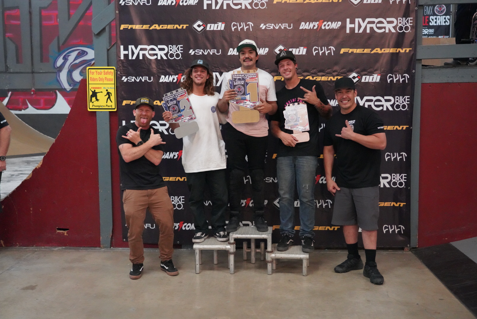 Free Agent rider Dante Tabuyo stand on the podium in first place at the first stop of the USA BMX Freestyle series at Premises Park in Tucson, Az.