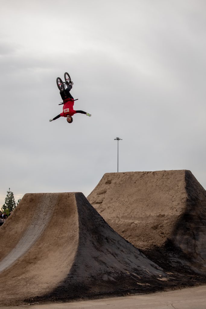 Free Agent rider Andy Buckworth giving it everything he has to win the BMX Triple Challenge best trick contest.